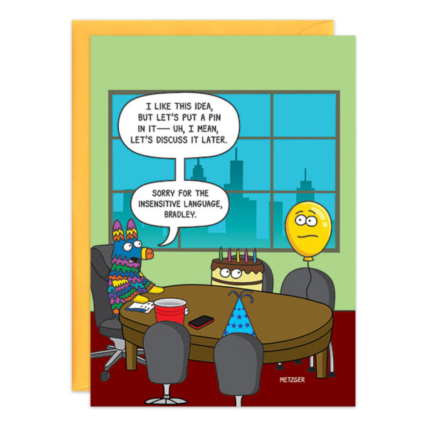 In a cartoon titled "9406," a piñata humorously shares a boardroom meeting table with a birthday cake and a yellow balloon. The piñata quips, “Let’s put a pin in it,” then quickly apologizes for the choice of words. A city skyline can be seen through the window in the background.