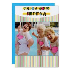 Three older women in cartoon bikini swimsuits laugh by a pool, with colorful striped borders and "Enjoy Your Birthday!" at the top. The 7450.jpg card is perfect for birthdays and comes with a blue envelope in the background.