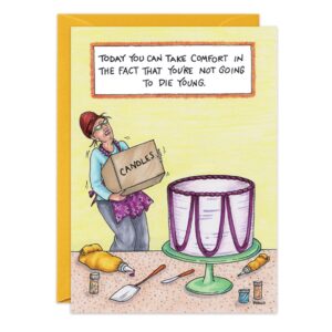 A woman struggles to carry a large 9151.jpg box toward an oversized cake. Above her, a sign reads, "Birthday Card: Take comfort—not going to die young today," with baking supplies scattered around.