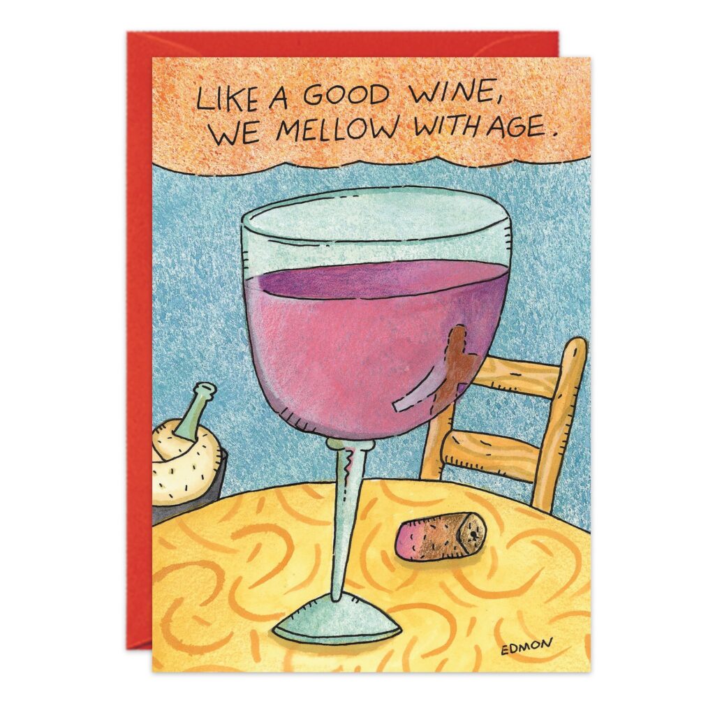 4820.jpg Birthday Card features a large glass of red wine on a table with a cork and bottle, and a chair in the background. Caption: "Like a good wine, we mellow with age.