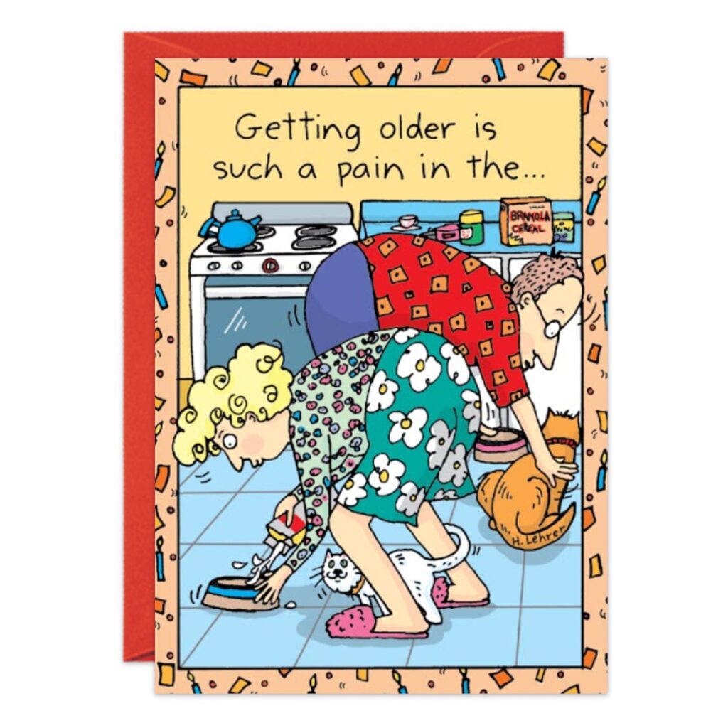 Cartoon features an older man and woman bending over with pained expressions, picking up pets in a kitchen. Caption: "Getting older is such a pain in the...". Great for birthdays! Product: 7058.jpg.