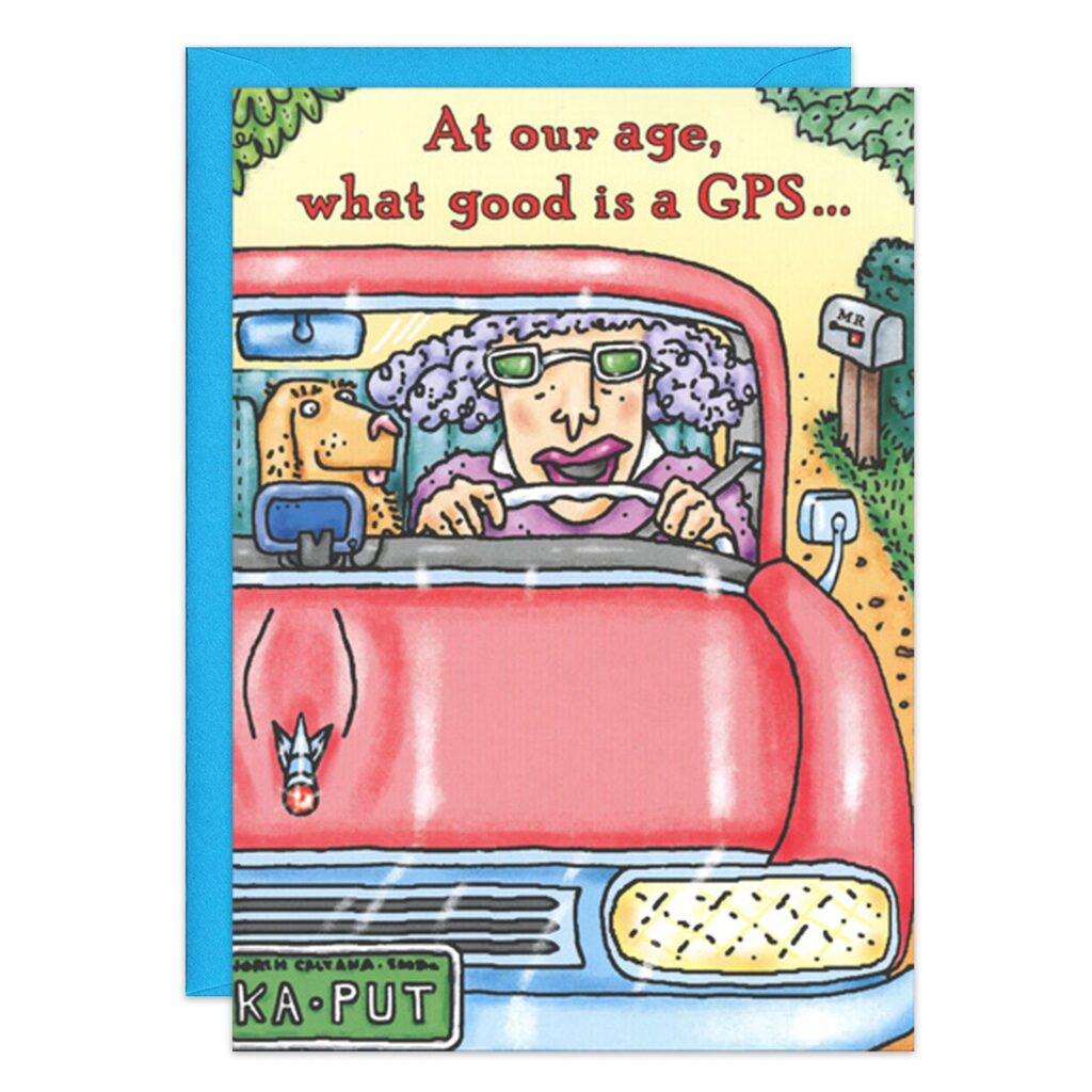 8085.jpg: Cartoon of a gray-haired elderly woman with glasses driving a red car accompanied by her dog. The text above reads, "At our age, what good is a GPS..." Mailbox and trees in the background. Funny GPS birthday card.