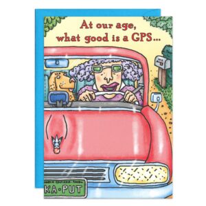 Cartoon of a gray-haired elderly woman with glasses driving a red car with her dog, featured on 8085.jpg, a playful GPS Birthday Card reading “At our age, what good is a GPS…” with signpost and trees in the background.