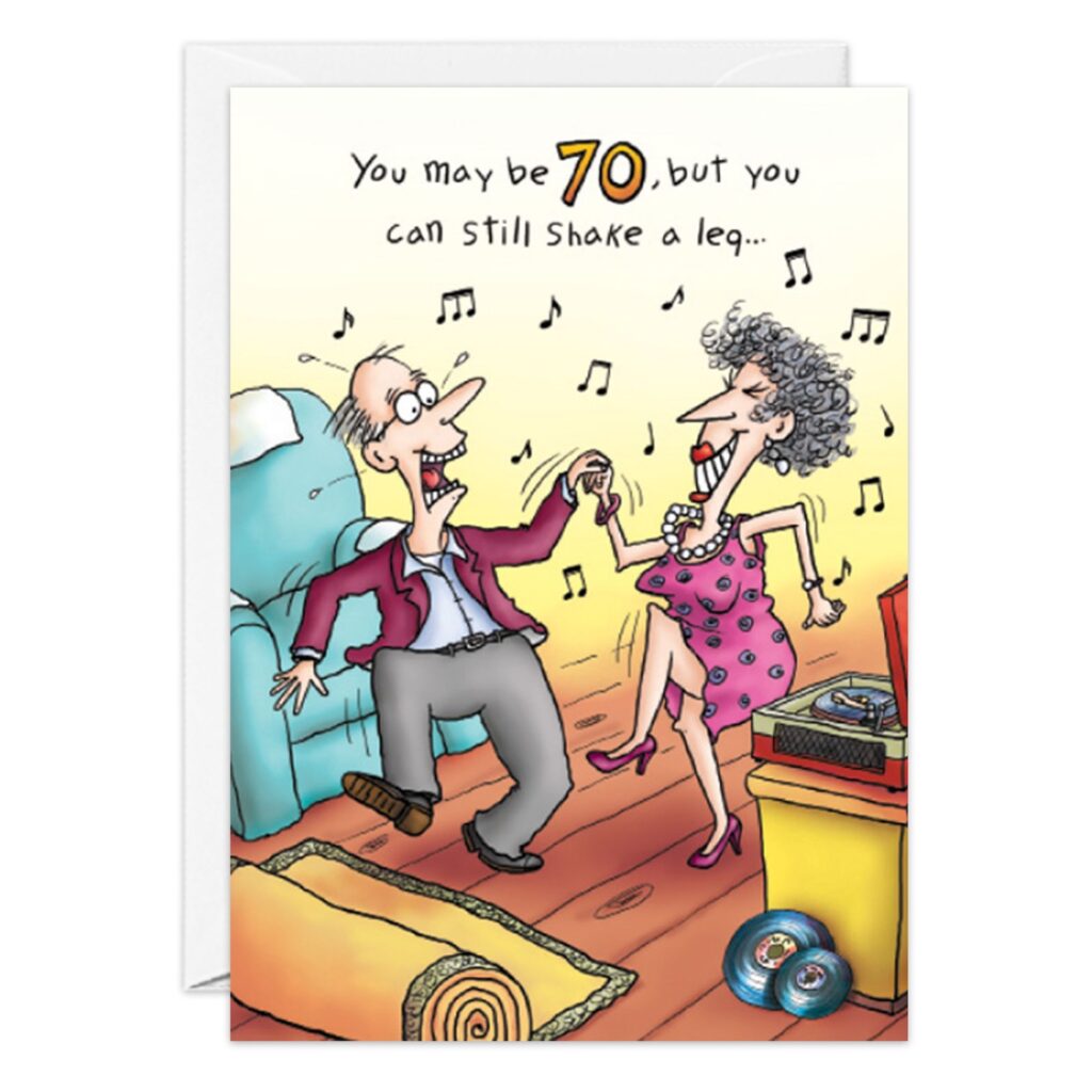 Cartoon of an older couple dancing joyfully in their living room, musical notes swirling and a record player nearby. Front: "You may be 70, but you can still shake a leg..." —the perfect Dancing Birthday Card! Product: 8789.jpg.