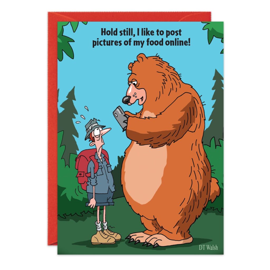 A large bear holds a phone and jokes to a nervous hiker, "Hold still, I like to post pictures of my Bear Food online!" Set in a cartoonish forest, this funny scene features on the 8953.jpg Bear Food Birthday Card.