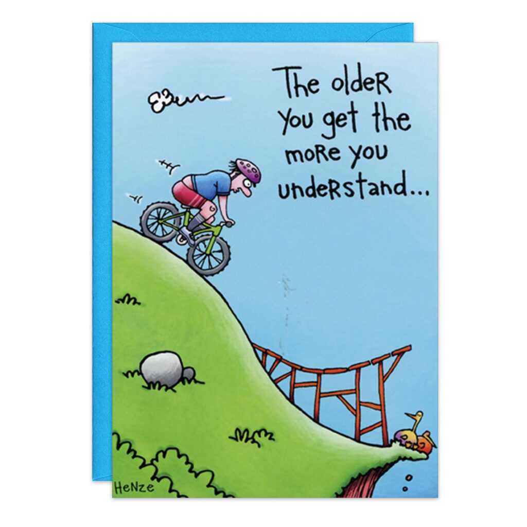 Cartoon birthday card (8978.jpg): An older person dirt biking down a hill toward a broken bridge, passing a fallen cyclist. Caption: "The older you get, the more you understand...