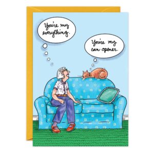 A woman smiles at an orange cat on a blue couch. She thinks, “You’re my everything.” The cat thinks, “You’re my can opener.” A yellow envelope sits behind the Can Opener Birthday Card (9089.jpg).