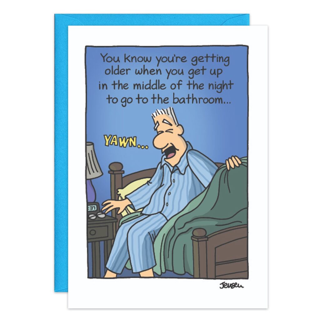 Cartoon of a sleepy man in blue pajamas sitting on his bed at night, yawning. Text above: “You know you’re getting older when you wake up in the middle of the night…”—9100.jpg Birthday Card.