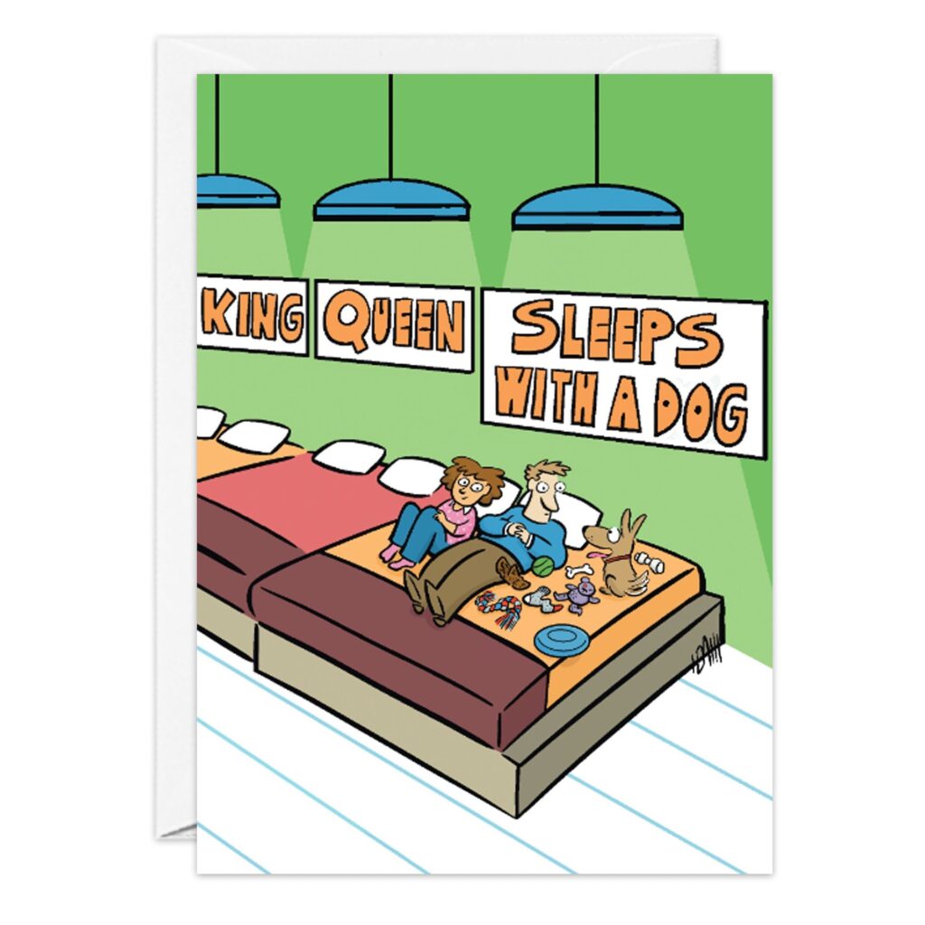 Cartoon of a couple and dog in bed with toys, under signs reading King, Queen, and Sleeps With A Dog. The card—9234.jpg—is a cute, funny birthday card perfect for anyone whose pup takes over the bed!.
