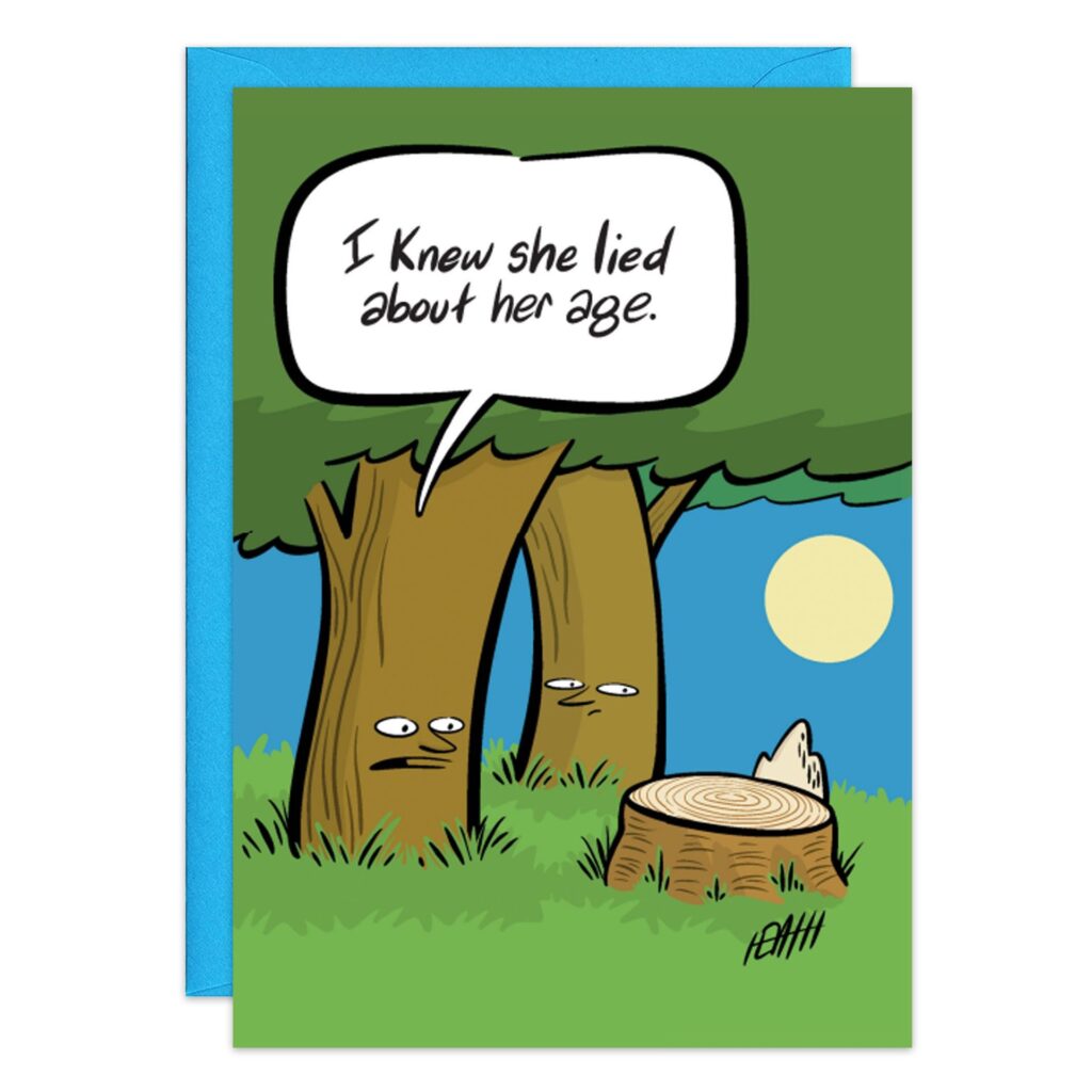The 9242.jpg Birthday Card features two cartoon trees; one says, "I knew she lied about her age," as they look at a tree stump's rings beneath a blue sky and full moon. Includes a blue envelope.