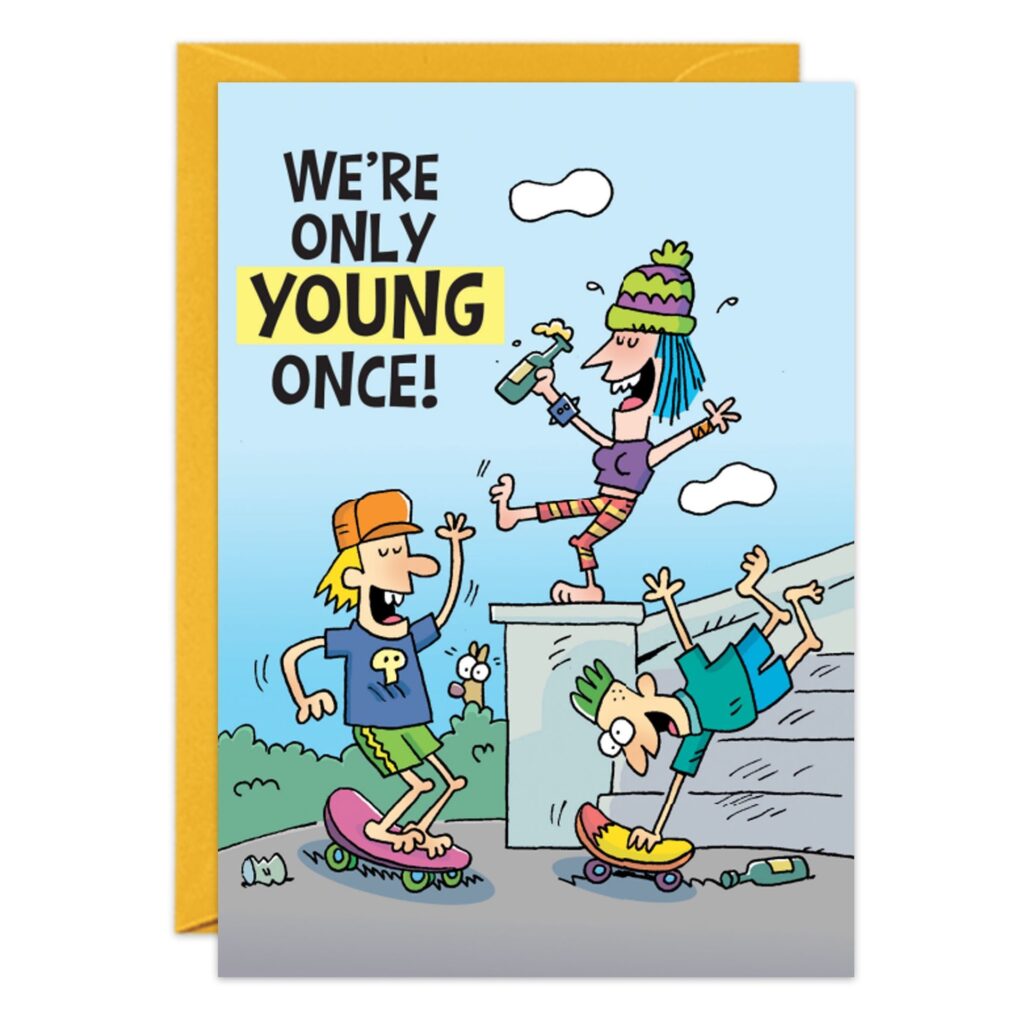Cartoon of three adults skateboarding—one drinks from a bottle, one cheers, and one falls off. Text: "We’re only young once!" Great for a Young Once Birthday Card. Yellow envelope in background. Product Name: 9245.jpg.