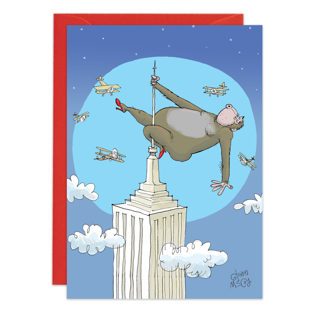 Cartoon of a pole-dancing gorilla in red heels atop the Empire State Building at night with vintage airplanes circling—Product 9467 makes a quirky birthday card.