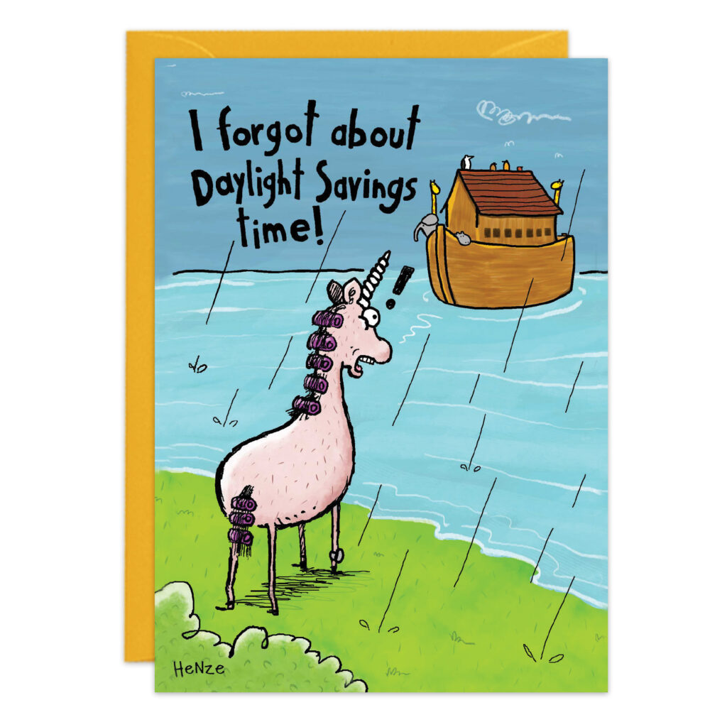 A whimsical birthday card (Product 9481) shows a cartoon unicorn standing in the rain by water, watching Noah's Ark sail off. "I forgot about Daylight Savings Time!" reads the card, with grass, water, and a yellow envelope in the background.